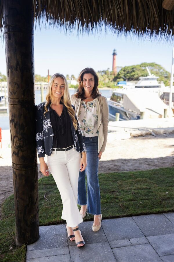 Kristen Danzig and Amanda Caracuzzo, Compass Florida real estate agents in Jupiter, by the Jupiter Inlet Lighthouse