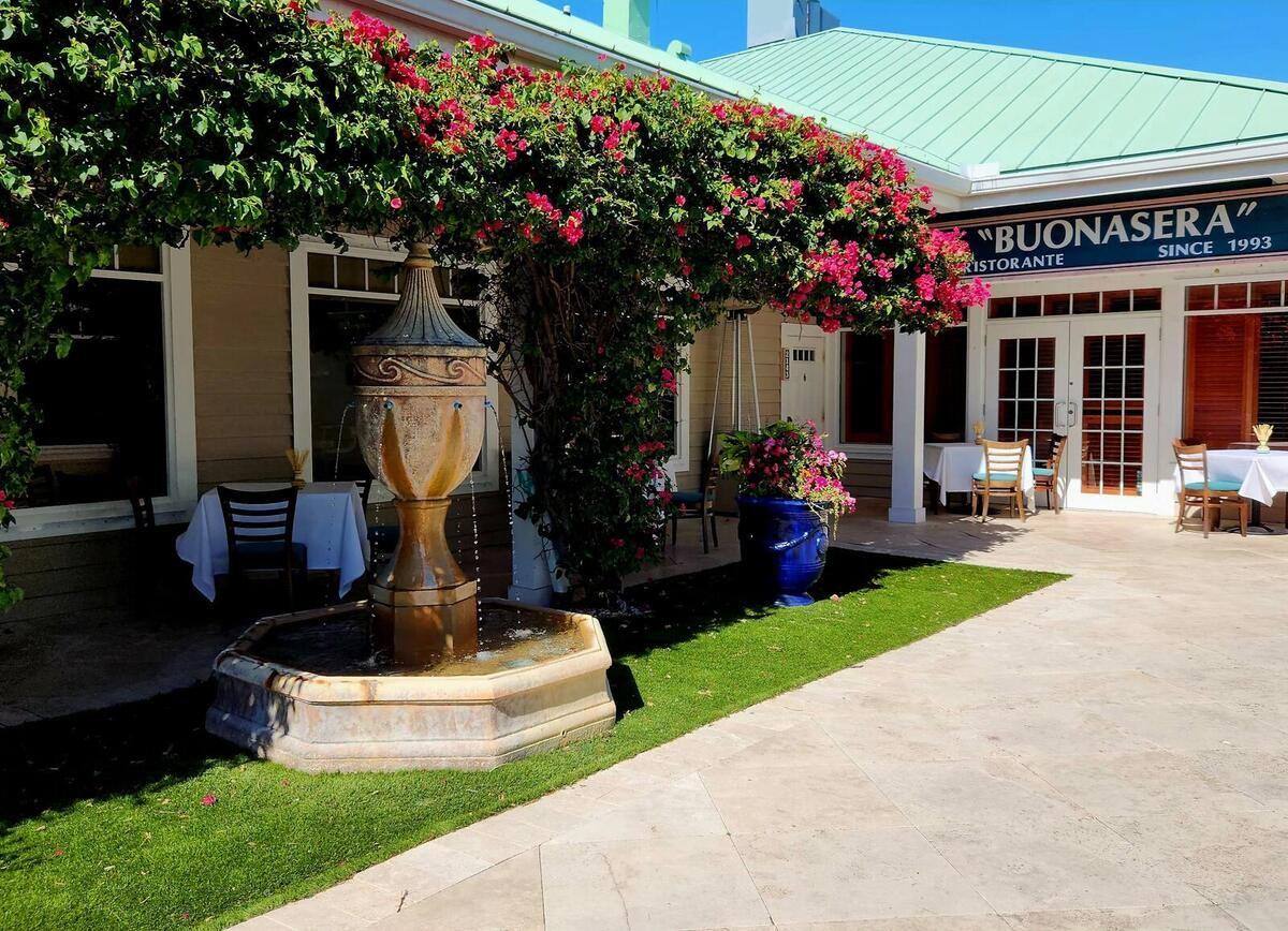 Buonasera Italian restaurant entrance with bougainvillea