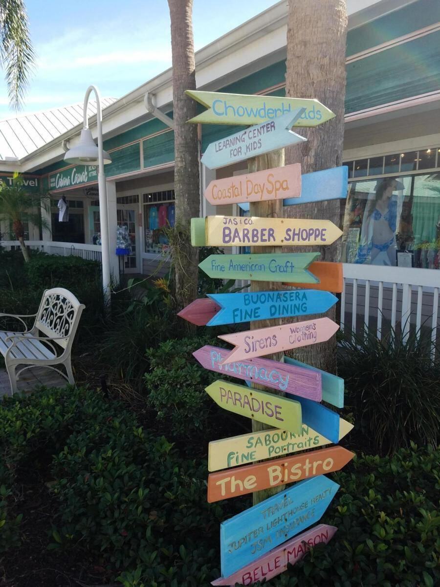 Colorful directional signs at the shops near Sea Colony